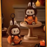 Pop Mart Labubu Vinyl Plush Pumpkin Party Keychain Halloween Special Edition is an adorably lovable treat that mixes eerie enchantment with peppy festive flair in a single pint-sized package