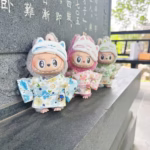 Doll clothes for Labubu Idol Doll plushies measuring 15–17 cm. Comes with a kimono skirt, eye mask, and fits V1, V2, V3. Two-pack perfect for decoration or gifting - Image 2