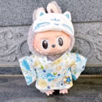 Doll clothes for Labubu Idol Doll plushies measuring 15–17 cm. Comes with a kimono skirt, eye mask, and fits V1, V2, V3. Two-pack perfect for decoration or gifting