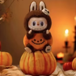 Pop Mart Labubu Vinyl Plush Pumpkin Party Keychain Halloween Special Edition is an adorably lovable treat that mixes eerie enchantment with peppy festive flair in a single pint-sized package - Image 2